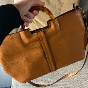 Lexi and Abbie luggage/gold faux leather handbag with plastic handle and strap